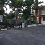 Image of cement blocks neatly stacked and partial wall completion in background.
